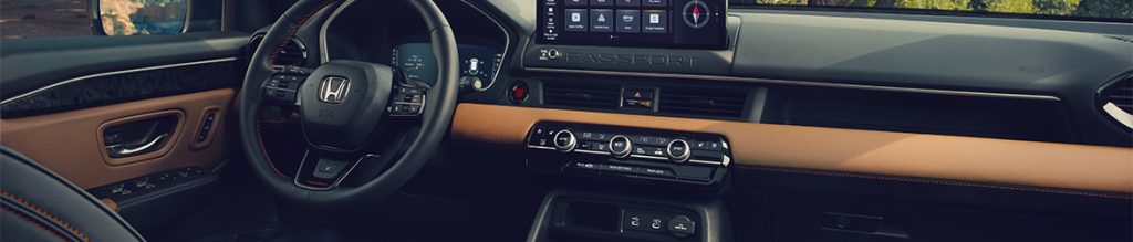 2026 Honda Passport interior showcasing dashboard and steering wheel design